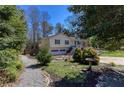 Charming yellow home with inviting front yard and a two-car garage, perfect for families at 2426 Westland Way, Acworth, GA 30102