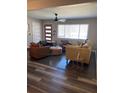 Inviting living room with a plush sofa, leather chairs, and modern vinyl plank flooring at 4025 Gretna Green Dr, Decatur, GA 30035