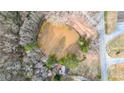 Aerial view of a home nestled next to a pond, showcasing its natural surroundings at 257 Crossroads Church Rd, Rockmart, GA 30153