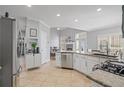 Well-equipped kitchen featuring stainless steel appliances, granite countertops, and tile flooring at 3775 Lake Seminole Dr, Buford, GA 30519