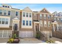 Desirable townhome community with brick facades, attached garages, and inviting entryways at 826 Bexley Park Way, Mableton, GA 30126