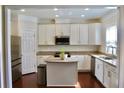 Well-lit kitchen with white cabinets, stainless steel appliances, and granite countertops, providing a functional layout at 826 Bexley Park Way, Mableton, GA 30126