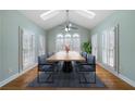 Dining room with a large table, vaulted ceiling, skylights, and lots of natural light at 2883 Observation Nw Pt, Marietta, GA 30064