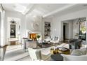 Bright living room featuring a fireplace, stylish furnishings, and multiple entryways at 4380 Garmon Nw Rd, Atlanta, GA 30327