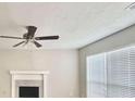 Bright living room with a fireplace and large window at 738 Windsor Cir, Lawrenceville, GA 30046