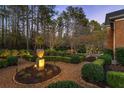Professionally landscaped backyard featuring stone pathways and manicured shrubs and garden at 5400 Saint Lyonn Pl, Marietta, GA 30068