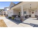 Charming front porch with rocking chairs and stone accents at 1784 Treymire Ct, Stone Mountain, GA 30088