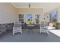 Inviting front porch featuring comfortable seating and stylish decor at 1784 Treymire Ct, Stone Mountain, GA 30088