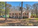 Charming brick home featuring classic shutters and a well-maintained yard at 3045 Riviera Nw Dr, Conyers, GA 30012