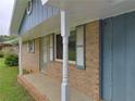 Close up of the brick exterior with classic blue shutters and trim at 401 Peggy Ln, Villa Rica, GA 30180