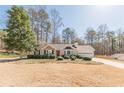 Charming single Gathering home boasting manicured landscaping and a two-car garage at 7238 Hummingbird Ln, Winston, GA 30187
