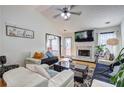 Bright living room with vaulted ceilings, fireplace, and door to outdoor space at 375 Tambec Nw Trce, Lilburn, GA 30047