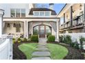 Inviting front entrance featuring a stone pathway and lush landscaping at 2500 Brook Run, Alpharetta, GA 30009