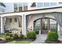 Charming front porch with comfortable seating and stylish lighting fixtures at 2500 Brook Run, Alpharetta, GA 30009