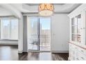 Living room with balcony access and city views, as well as white cabinetry at 3445 Stratford Ne Rd # 502, Atlanta, GA 30326