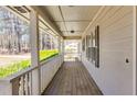 Charming covered porch with wooden decking, offering outdoor relaxation space at 150 Hickory Rd, Fayetteville, GA 30214