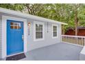Close up of home's entrance, showcasing a blue front door, white trim, and modern house number at 2598 Elliott Nw St, Atlanta, GA 30318