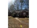 Charming brick home featuring a well-maintained front yard with trees at 2319 Browns Mill Se Rd, Atlanta, GA 30315