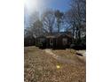 Charming brick home featuring a well-maintained front yard with trees at 2319 Browns Mill Se Rd, Atlanta, GA 30315