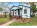 Home featuring a covered porch and landscaped front yard at 819 Humphries St, Atlanta, GA 30310