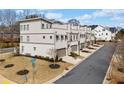 View of modern townhomes with sidewalks and well-maintained landscaping at 2712 Stargazer Ter, Smyrna, GA 30080