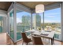 Bright dining room area with modern furnishings and expansive city views at 3324 Peachtree Ne Rd # 1718, Atlanta, GA 30326