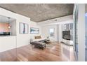 Open living area with hardwood floors, contemporary furniture, and great natural light at 3324 Peachtree Ne Rd # 1718, Atlanta, GA 30326