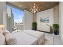 Serene bedroom with large window, white bedding, and stylish decor at 3324 Peachtree Ne Rd # 1718, Atlanta, GA 30326