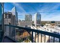 Balcony view of city skyline featuring modern architecture and a mix of residential and commercial buildings at 3324 Peachtree Ne Rd # 1718, Atlanta, GA 30326