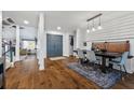 Open-concept dining area with hardwood floors and modern lighting at 3071 Balearic Se Dr, Marietta, GA 30067