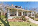 Inviting two-story home featuring a spacious front porch and well-maintained landscaping at 1118 Glenwood Se Ave, Atlanta, GA 30316