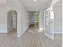 Bright entryway featuring wood floors, white trim, and natural light through the front door at 1516 Montauk Pt, Conyers, GA 30013