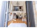 Bright, two-story foyer with hardwood floors, a grand staircase, and a decorative chandelier at 3290 Coachmans Ne Way, Roswell, GA 30075