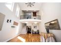 Welcoming foyer with high ceilings, hardwood floors, wrought iron balcony, and natural light at 3290 Coachmans Ne Way, Roswell, GA 30075