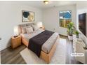 Inviting bedroom with ample natural light, neutral tones, and stylish decor at 1958 Brittania Cir, Woodstock, GA 30188