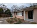 Classic brick home with black shutters, neat landscaping, and a welcoming entryway at 2689 Rollingwood Se Ln, Atlanta, GA 30316