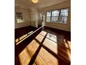Sun-drenched living area with hardwood floors, built-in shelving and ample natural light at 512 Alpine Way, Marietta, GA 30062