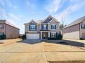 Beautiful two-story home with a two car garage, and well maintained lawn at 7644 Watson Cir, Locust Grove, GA 30248