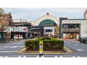 A lively street view of a shopping center with multiple shops and restaurants at 390 17Th Nw St # 2025, Atlanta, GA 30363