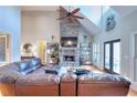 Living room with stone fireplace, high ceilings, and plenty of natural light at 4539 Tiffany Ln, Loganville, GA 30052