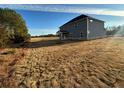 Expansive backyard featuring newly installed sod and ample space for various outdoor activities at 3166 Morris Hills Dr, Dacula, GA 30019