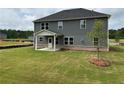 View of the backyard featuring a covered patio and newly installed sod at 3166 Morris Hills Dr, Dacula, GA 30019