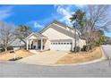 Charming single-Gathering home features a well-maintained front yard and inviting entrance with covered porch at 6 Alicia Ct, Marietta, GA 30062