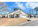 Charming single-Gathering home features a well-maintained front yard and inviting entrance with covered porch at 6 Alicia Ct, Marietta, GA 30062