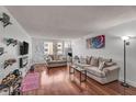 Bright living room with hardwood floors, neutral paint, and comfortable furnishings at 2479 Peachtree Ne Rd # 508, Atlanta, GA 30305