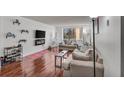 Cozy living room features hardwood floors, neutral decor, and plenty of natural light at 2479 Peachtree Ne Rd # 508, Atlanta, GA 30305