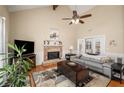 Bright living room with vaulted ceilings, a cozy fireplace, and hardwood floors, creating an inviting space at 580 Holt Ne Rd, Marietta, GA 30068