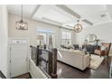 Bright living room with coffered ceilings, hardwood floors, and stylish decor at 109 Bridlington St, Sugar Hill, GA 30518