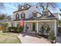 Charming two-story home with a welcoming front porch and a brick pathway at 2083 Fairhaven Ne Cir, Atlanta, GA 30305