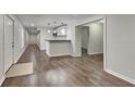 Spacious basement area with bar, modern lighting, and sleek floors at 45 Kirkland Ct, Covington, GA 30016